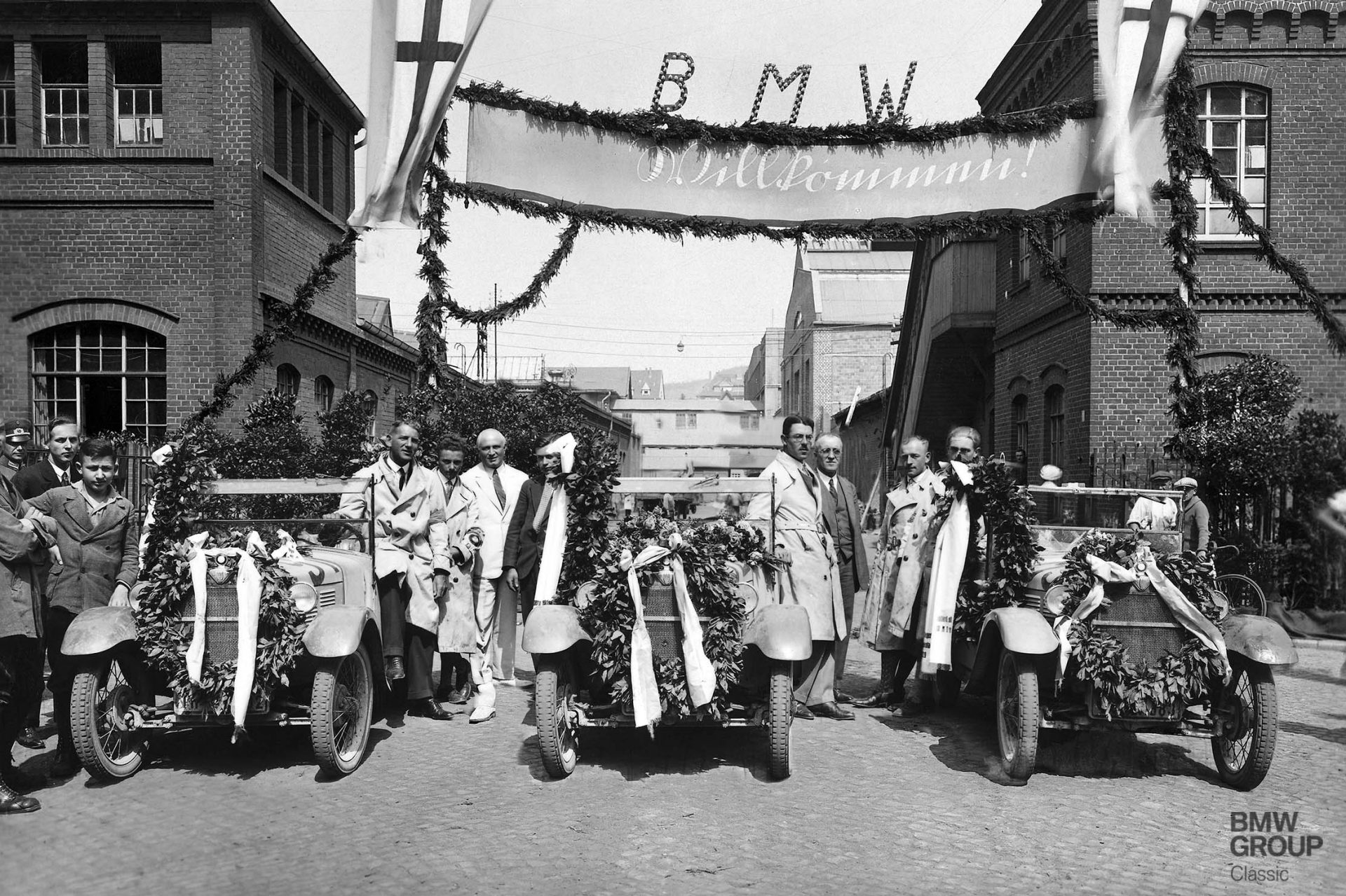 The triumphant BMW team on their return home. They alone finished the event without collecting a single penalty point.