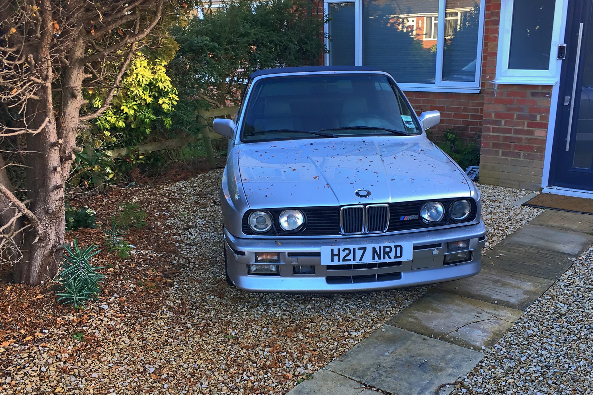 BMW M3 Convertible in front of English country house
