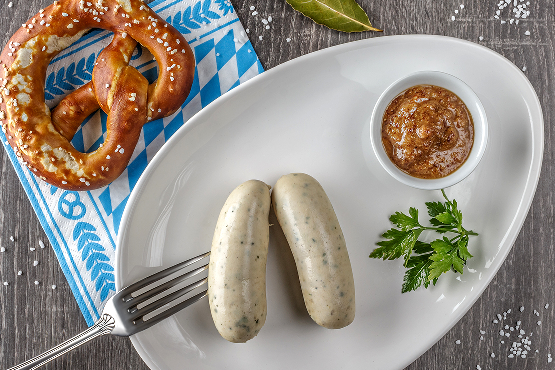 Traditional Bavarian breakfast with pretzels, a pair of white sausages and the obligatory sweet mustard.