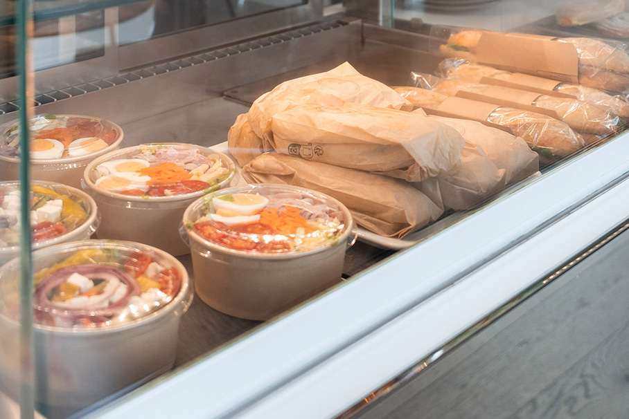 Counter in the BMW Classic Café with salads and various baguettes.
