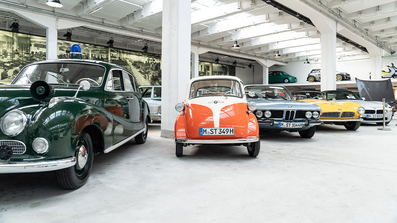 A view of the classic car exhibition featuring a BMW Baroque Angel as a police car, a BMW Isetta, a BMW 507, a BMW Z8 and other vehicles.