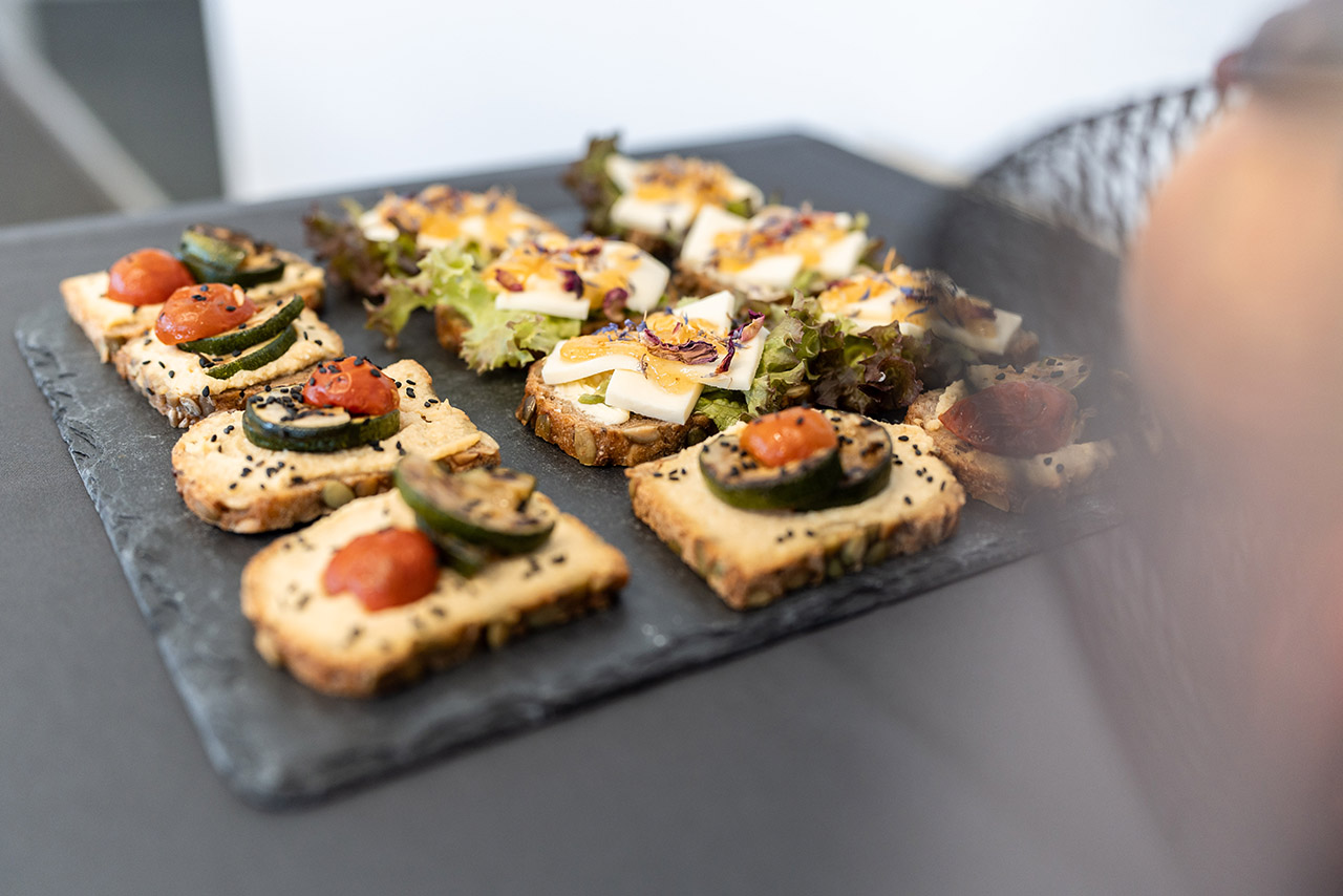 A decorative tray with a selection of appetizers on a table, ideal for social occasions.