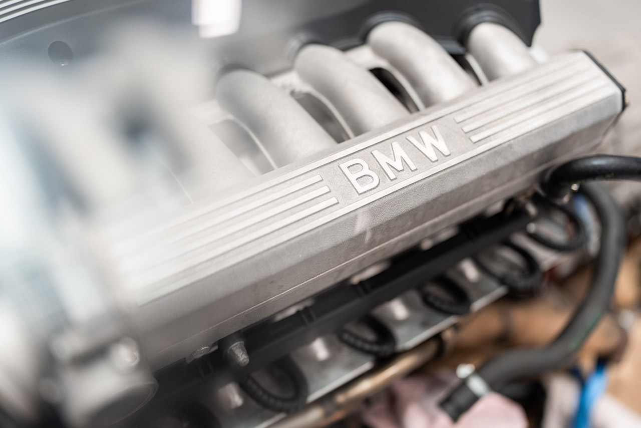 Detailed close-up of a BMW engine, showing precise engineering and technology.