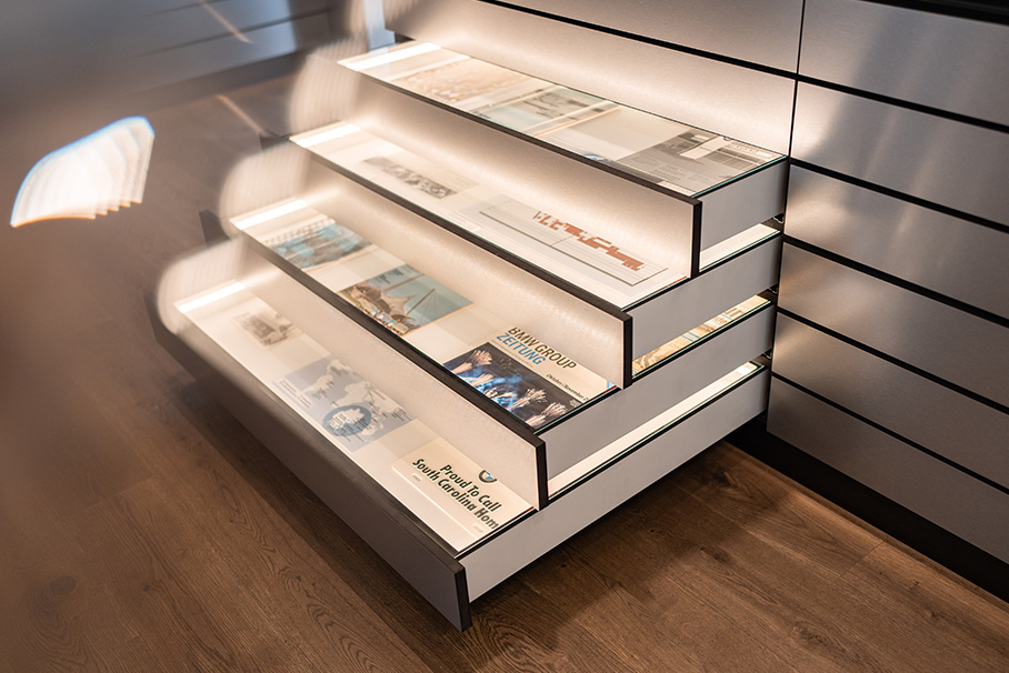 A shelf with books in a room that creates a cozy and inviting atmosphere.