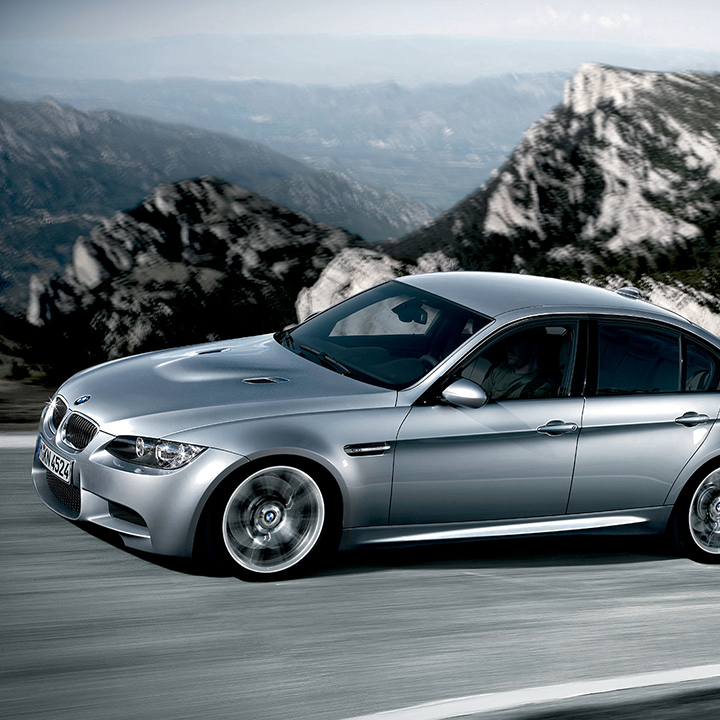 BMW 3 series 5th generation on a scenic road