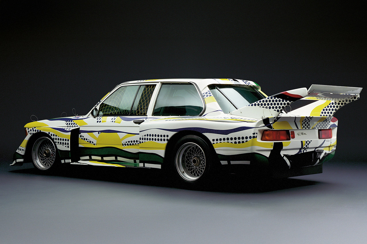BMW 320i Turbo in whitw with yellow and bluw painted on it