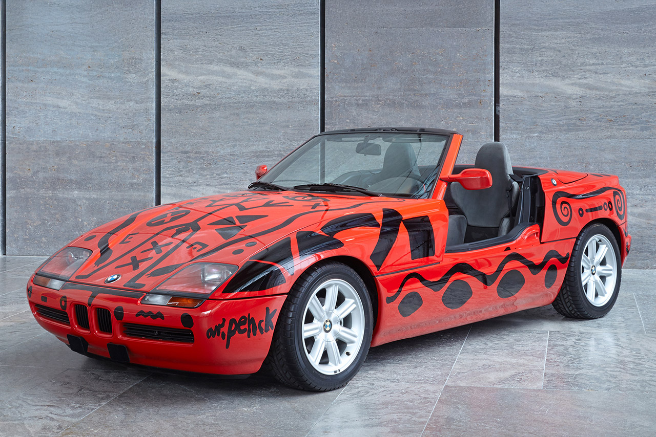 Red BMW Z1 with black paintings looking like cove paintings