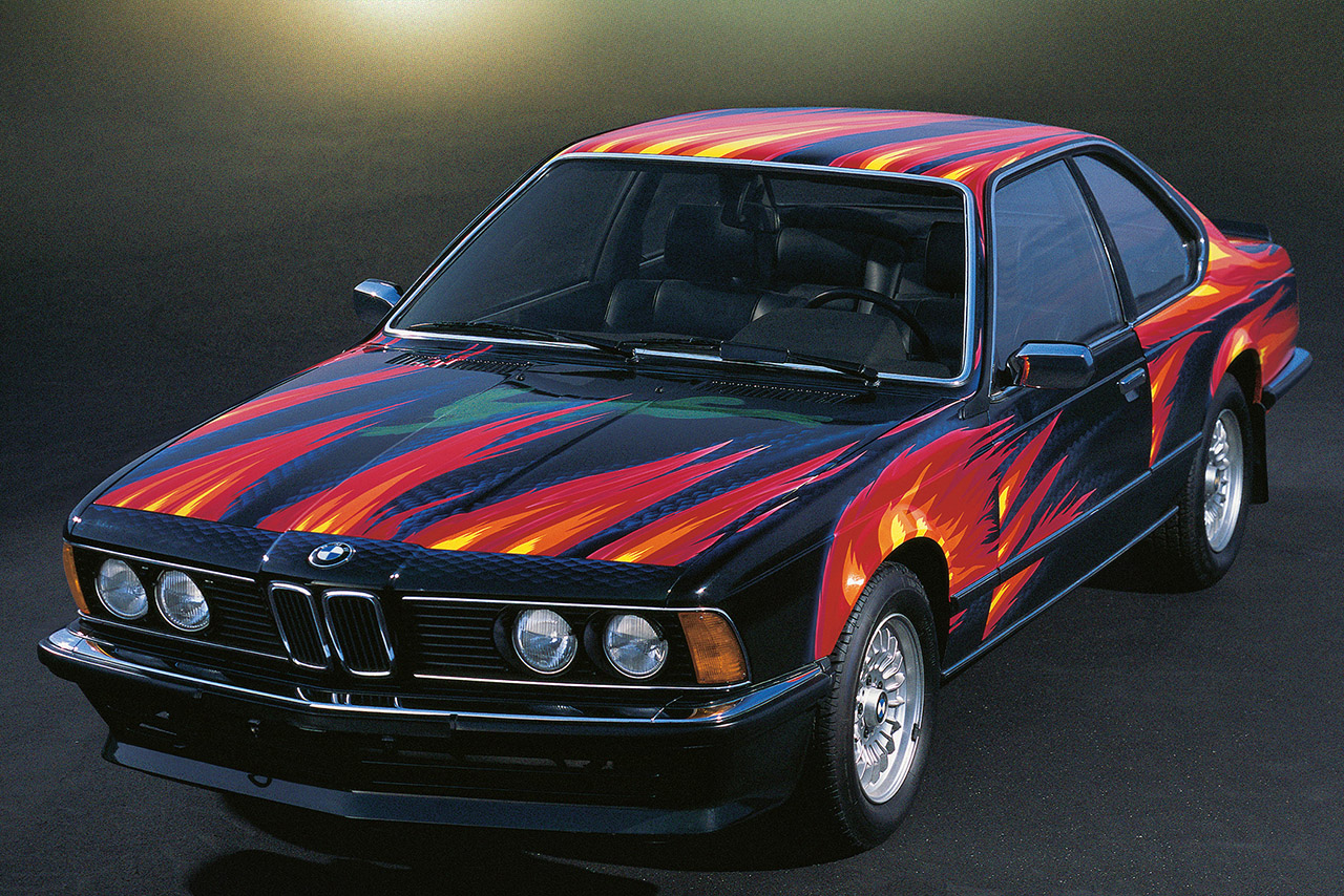 BMW 635 CSi in black with red flames painted on it
